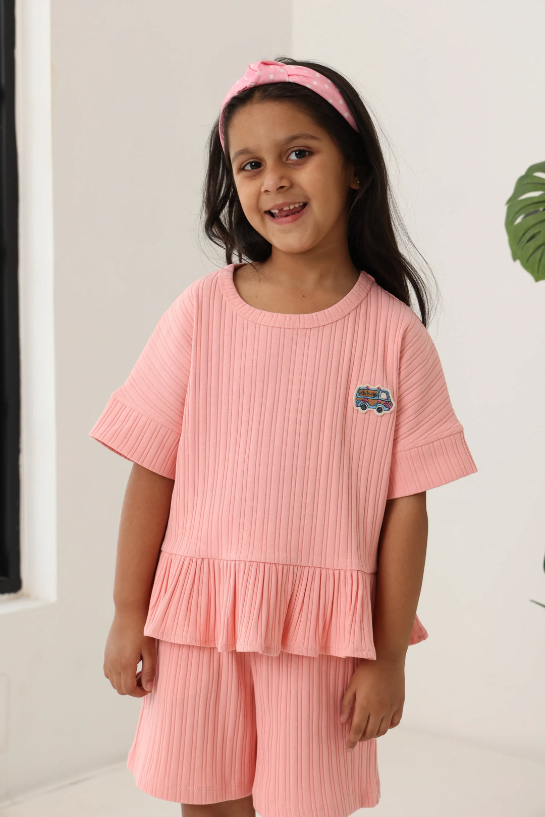 Spunkies Girls Pink Textured Round Neck Short Sleeves Peplum Top and Shorts Set